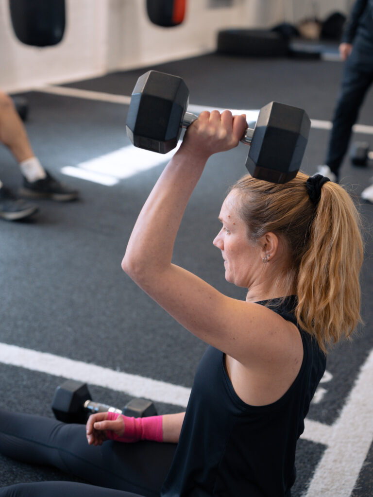 Rachael smiling during a session at The Training Gyms in Milton Keynes, showing the positive atmosphere of personal training in a supportive environment.