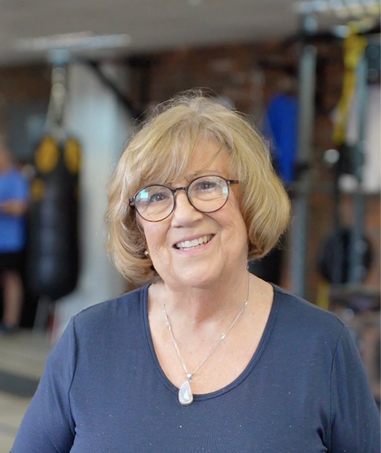 Personal training in Hitchin – client being coached through strength training in a friendly, supportive space.