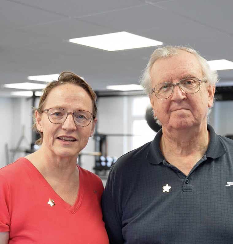 Sara and Michael smiling at the gym – personal training in St Albans helped them get stronger and more confident together.